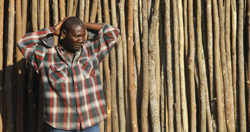 A roadside vendor with his supply of lumber. [PHOTO: DAN BLACK]
