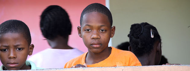 Two boys stare at a delegation of Canadians visiting the orphanage earlier this year. [PHOTO: DAN BLACK]