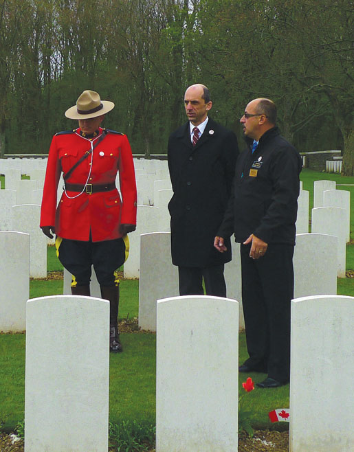 RCMP Constable Jason Lilly, Veterans Affairs Minister Steven Blaney and veteran Reno St-Germain at Canadian Cemetery No. 2.