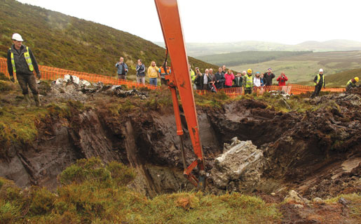 A Spitfire’s engine is raised from the peat in County Donegal, Ireland. [PHOTO: JONNY McNEE]