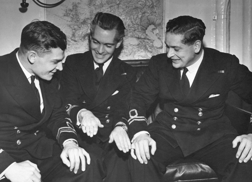 Lieutenant-Commander Digby Cosh (left) and lieutenants A.N. Pym and H.P. Wilson share a moment after the 1944 raid on Tirpitz. [PHOTO: COURTESY YOLANDE MCLEAN]