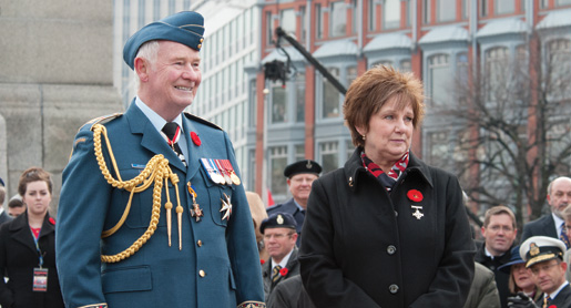 Governor General David Johnston and National Silver Cross Mother Roxanne Marie Priede watch as the veterans march past. [PHOTO: MARC FOWLER & RANDY HARQUAIL/METROPOLIS STUDIO]