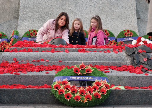 Poppies are placed on the Tomb of the Unknown Soldier. [PHOTO: MARC FOWLER & RANDY HARQUAIL/METROPOLIS STUDIO]