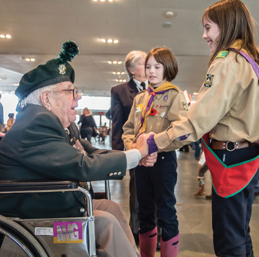 Scouts greet Ted Patrick at the Canadian War Museum. [PHOTO: DAN WARD]