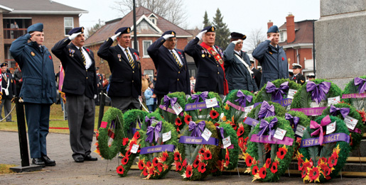 Port Arthur and Polish Combatants Branch members salute. [PHOTO: SHARON ADAMS]