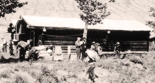 The Mad Trapper of Rat River, Albert Johnson (light haired man near tree-centre). [PHOTO: LIBRARY AND ARCHIVES CANADA—C039883]