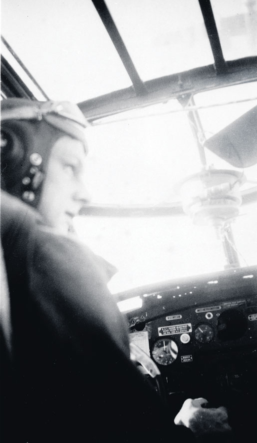 Flying Officer Robert Fowler in the cockpit of his Mitchell bomber of No. 226 Squadron, RAF, 1944. [PHOTO: LIBRARY AND ARCHIVES CANADA—PA123031]