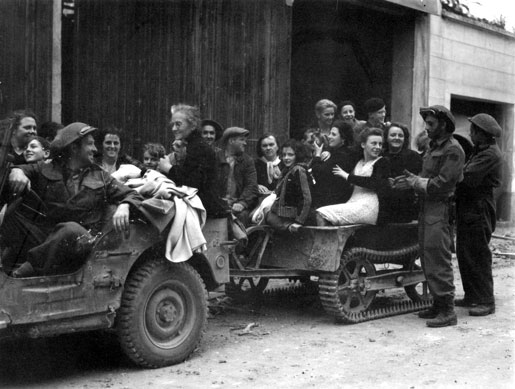 French citizens are evacuated by the Fusiliers Mont-Royal, Falaise, August 1944. [PHOTO: LIEUT. DONALD I. GRANT, LIBRARY AND ARCHIVES CANADA—PA140211]
