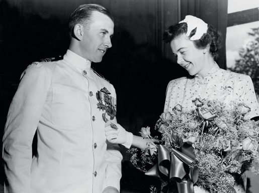 Lieutenant-Commander Joseph MacBrien and his wife after the Canadian naval aviator is presented with an American Distinguished Flying Cross in 1954. [PHOTO: CANADIAN FORCES—O-7147]
