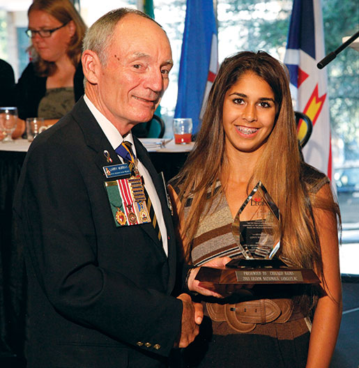 Legion Grand President Larry Murray presents the Leroy Washburn Award to Chicago Bains. [PHOTO: ADAM DAY]