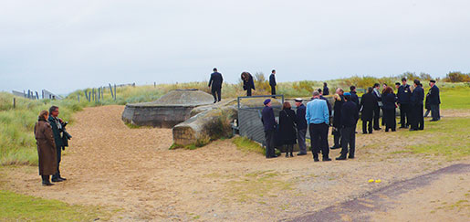 Students and veterans explore a German bunker on Juno Beach. [PHOTO: SHARON ADAMS]