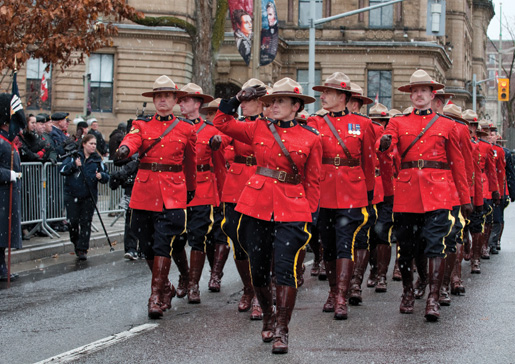 The RCMP contingent nears the saluting base. [PHOTO: METROPOLIS STUDIO]