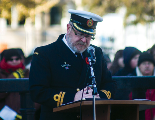Navy Lieutenant James Balfour leads the service. [PHOTO: TOM MacGREGOR]