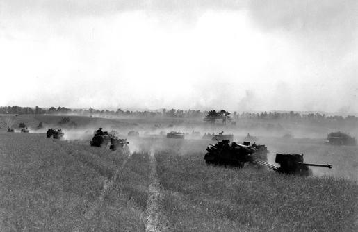 The 3rd Canadian Division advances south  of Bretteville-le-Rabet, France, Aug. 14, 1944. [PHOTOS: DONALD I. GRANT, DEPARTMENT OF NATIONAL DEFENCE/LIBRARY AND ARCHIVES CANADA—PA116536]