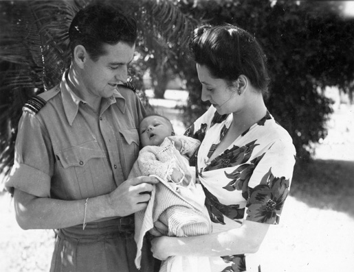 David Babineau, who was promoted to squadron leader, with his son David and wife Dorothy, February 1944. [PHOTO: LIBRARY AND ARCHIVES CANADA—PL-18834/CANADIAN WAR MUSEUM—19650071-007.p28b.tif]