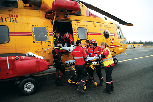 During the Sar Tech exercise in St. John’s, paramedics unload the injured from a Cormorant helicopter. [PHOTO: ADAM DAY]