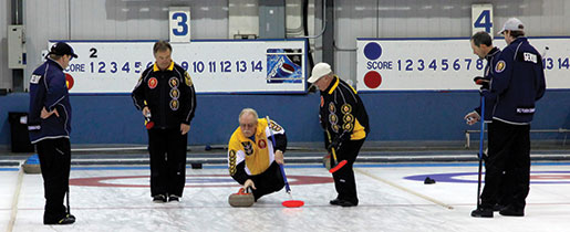 Manitoba’s Greg Thompson lets go a rock during the final game. [PHOTO: ADAM DAY]
