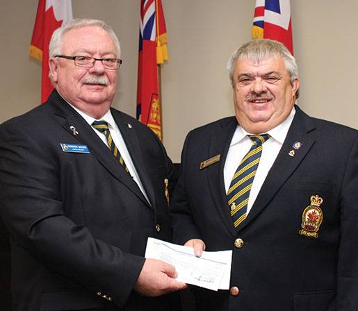 Dominion President Gordon Moore (left) accepts a donation for the Royal Commonwealth Ex-Services League from Newfoundland and Labrador Command President Ross Petten. [PHOTO: Sharon adams]