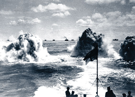 This undated photo shows depth charge explosions astern of HMCS Saguenay during convoy escort operations. [PHOTO: NATIONAL DEFENCE/LIBRARY AND ARCHIVES CANADA—PA116840]