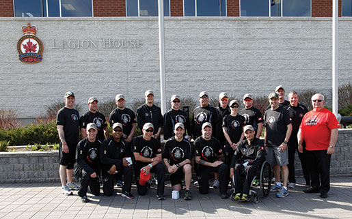 Dominion President Gordon Moore (right) joins members of the Soldier On Afghanistan relay team at Legion House in Kanata. [PHOTO: ADAM DAY]