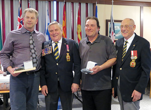 Doubles champions Sheldon Fudge (left) and Kevin Boylan (second right) of New Ross, N.S., Branch are congratulated by Dominion Command Sports Committee representative Angus Stanfield (second left) and Local Arrangements Committee Chairman  Len Marks. [PHOTO: SHARON ADAMS]