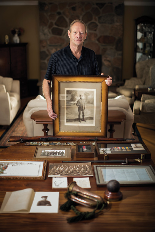 Chris Graham with a photograph of his grandfather Charles Heathcote Graham and some of his artifacts. [PHOTO: WAYNE SIMPSON PHOTOGRAPHY]