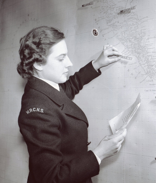 Plotting shipping movements on a chart, Ottawa, January 1943. [PHOTO: LIBRARY AND ARCHIVES CANADA—PA146026]