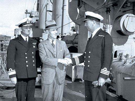 Naval minister Angus L. Macdonald is flanked by Captain G.C. Jones (left) and then-Commander E.R. Mainguy during a visit to HMCS Ottawa in 1940. [PHOTO: LIBRARY AND ARCHIVES CANADA—PA104080]