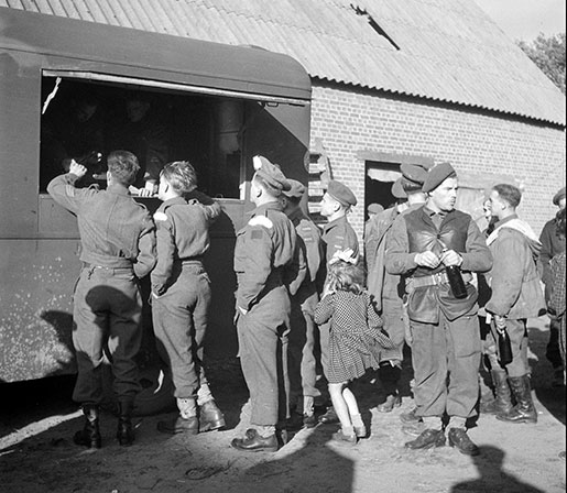 Canadian soldiers collect their beer ration at a canteen in the Netherlands, September 1944. [PHOTO: LIEUTENANT KEN BELL, LIBRARY AND ARCHIVES CANADA—PA168676]