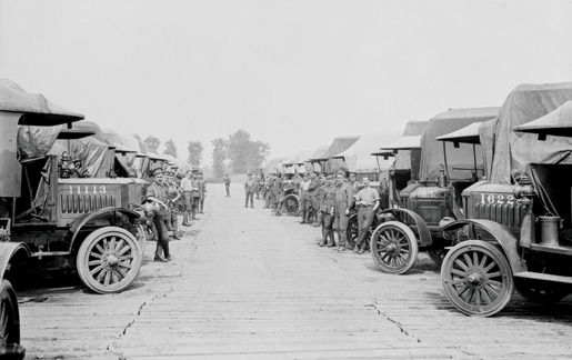 Lorries and men wait at an ammunition park, June 1916. [PHOTO: LIBRARY AND ARCHIVES CANADA—PA000014]