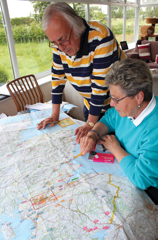 Diana Beaupré and Adrian Watkinson make plans for an upcoming trip to Canadian graves in Scotland. [PHOTO: DAN BLACK]
