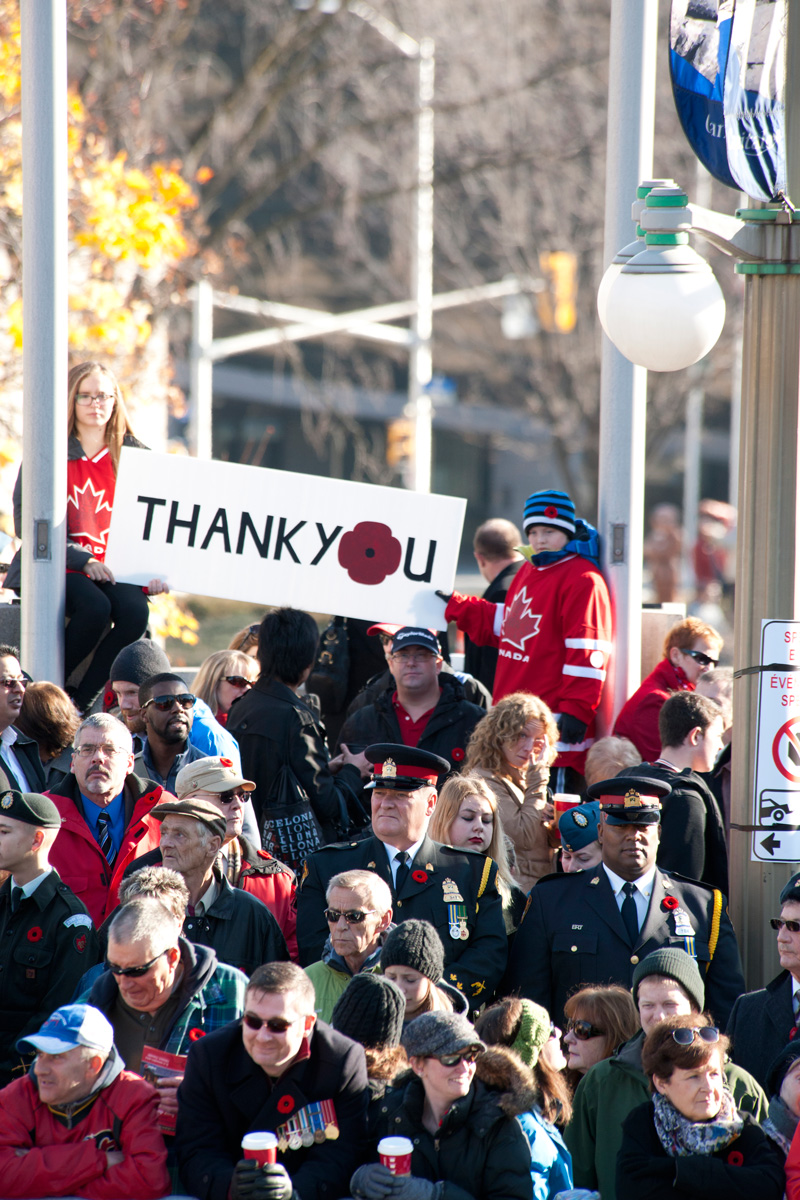 A crowd of more than 50,000 people showed their appreciation by wearing poppies, waving flags and holding up thank-you signs. [PHOTO: METROPOLIS STUDIO]