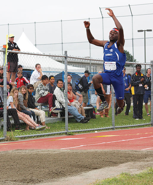 Ivan Nyemeck of Quebec performs a triple jump. [PHOTO:  sharon adams]