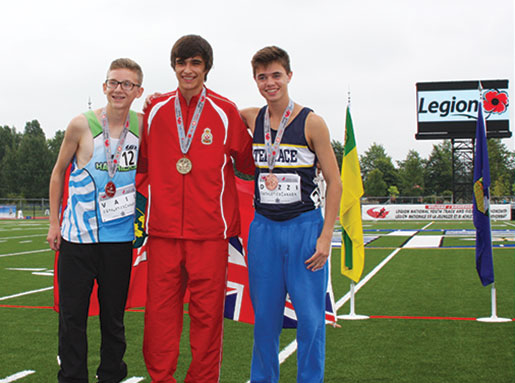 Mathieu Plamondon, flanked by Brandon Vail (left) and Tyler Dozzi take medals for the boys 2,000-metre run. [PHOTO: SHARON ADAM]