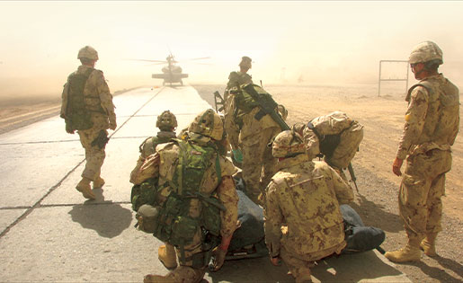 Wounded Canadian soldiers in Afghanistan await helicopter evacuation. [PHOTO: CPL. ROBIN MUGRIDGE]