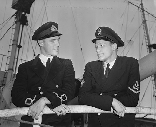 Sub-Lieutenant Hal Lawrence (left) and Stoker Petty Officer A.J. Powell jumped to the deck of the crippled U-boat as HMCS Oakville came alongside. [PHOTO: GEORGE A. LAWRENCE, DEPARTMENT OF NATIONAL DEFENCE, LIBRARY AND ARCHIVES CANADA—PA106526]