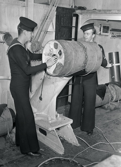 Able Seaman George Howard (left) and Leading Torpedoman Charles Skeggs also took part in the sinking of U-94. [PHOTO: LIEUTENANT GEORGE A. LAWRENCE, DEPARTMENT OF NATIONAL DEFENCE, LIBRARY AND ARCHIVES CANADA—PA106563]