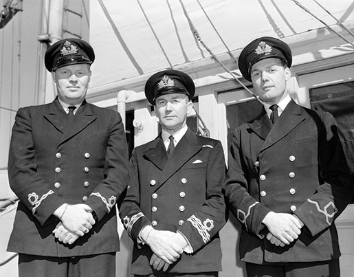 Oakville’s officers, from left: Sub-Lieutenant K.D. Fenwick, Lieutenant-Commander Clarence King and Sub-Lieutenant E.G. Scott shown in September 1942. [PHOTO: GEORGE LAWRENCE, DEPARTMENT OF NATIONAL DEFENCE, LIBRARY AND ARCHIVES CANADA—PA106482]