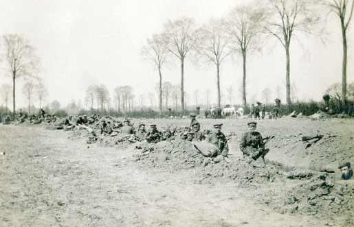 Soldiers nestle in a shallow trench near St. Julien, Belgium. [photo: CANADIAN WAR MUSEUM—19800833]