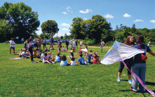 Children create an aerial tribute of brightly coloured kites. [PHOTO: CATHY HOLLIS]