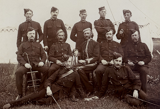 McCrae saw active military service in the Boer War as an artillery officer (back row, far left). [Guelph Civic Museum/M1968X.353.1.2]