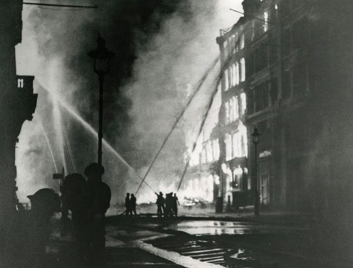 London’s fire brigade battles blazing buildings in Eastcheap Street during the Blitz. More than 20,000 incendiary bombs had been dropped on the city by the end of 1940. [Imperial War Museum/HU-1129]