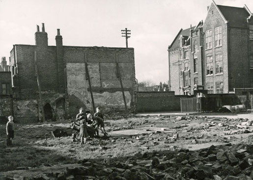 Children in Stepney, a district in the east end of London, play in a rubble-strewn lot where houses stood before Germany’s bombing blitz. [Legion Magazine archive]