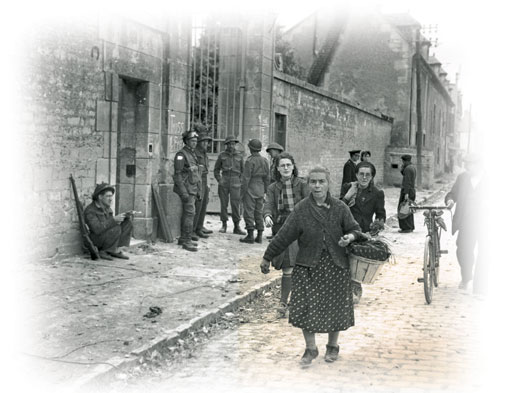 Street scene with Canadian soldiers and French civilians in Caen, France. [LAC/PA-162665]