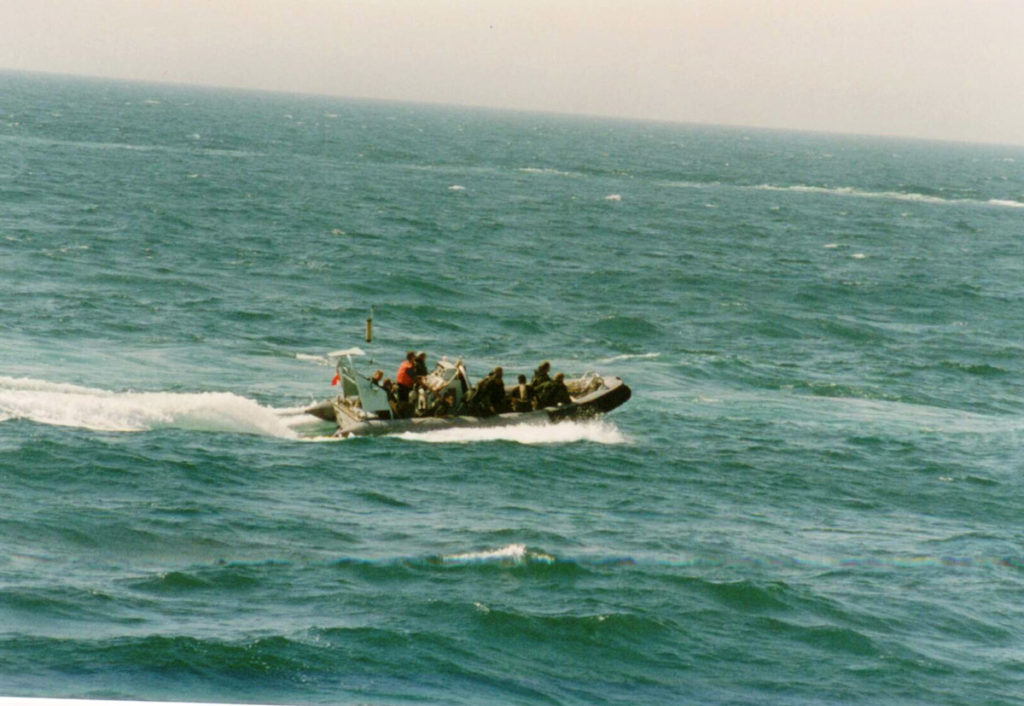 Members of HMCS Regina’s naval boarding party make their way in a rigid-hulled inflatable boat to a vessel in the Gulf of Oman during the Afghanistan War. 