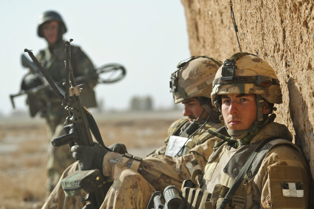 Canadian and Afghan national army soldiers patrol in Badula Qulp, Helmand province, Afghanistan, February 17, 2010. 