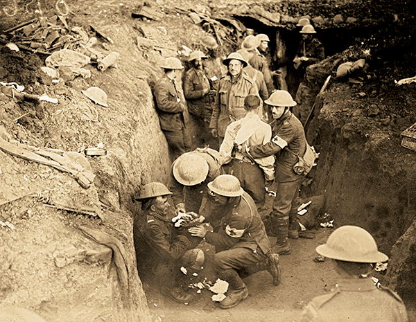 Medics tend to the wounded in a trench
