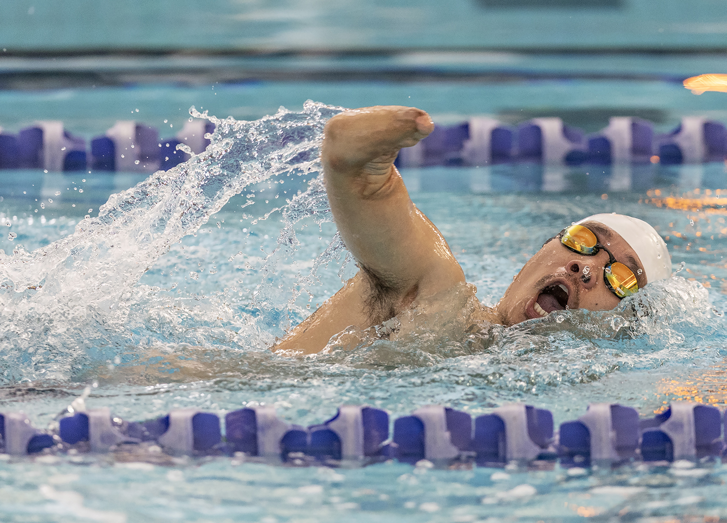 Hyeongyoon Na of South Korea, who lost both forearms to an electric fence at the North Korean border, competes in the 50m freestyle.[Stephen J. Thorne]