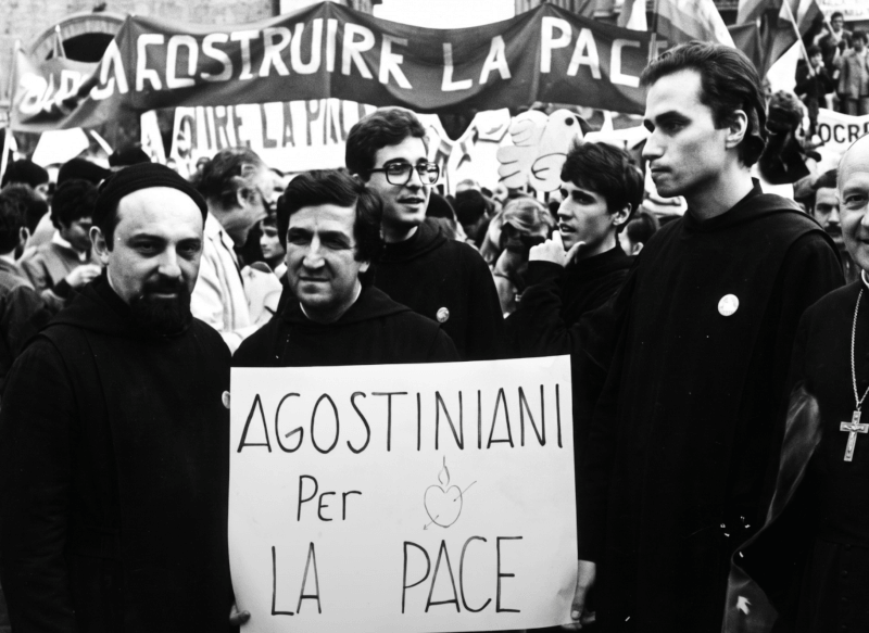 Robert Prevost (right), now Pope Leo XIV, at a peace rally in Rome in 1983 with fellow Augustinians. [Pax Christi Italia Archives/Wikipedia]